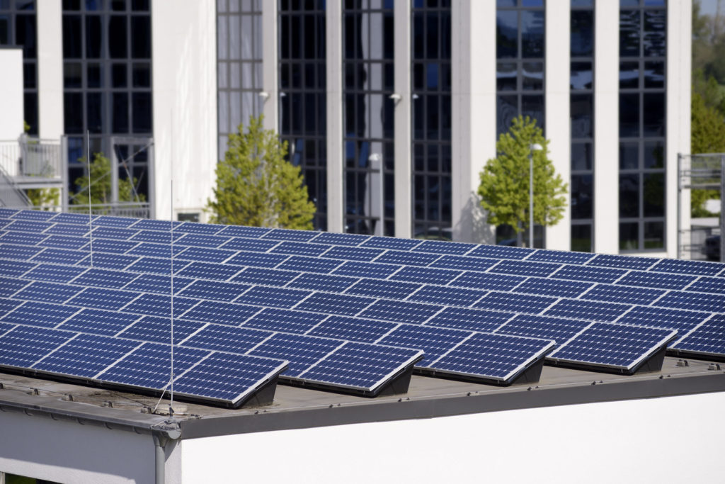 solar panels in front of a building