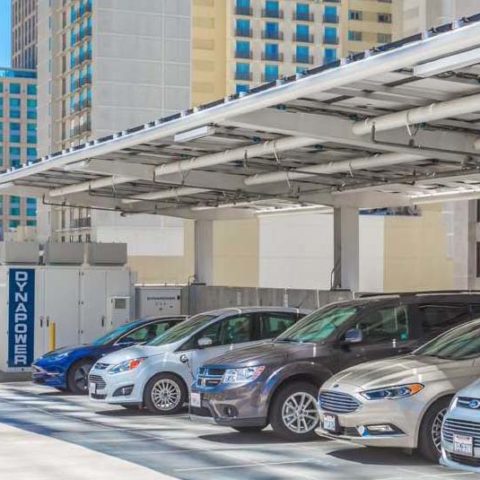 cars parked under EV charging station with dynapower logo