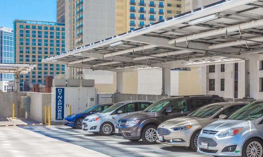 cars parked under EV charging station with dynapower logo